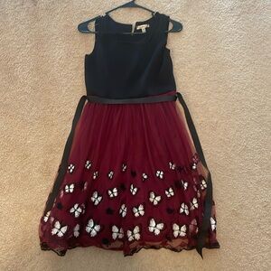 Party dress - black top, magenta bottom with butterflies. Ribbon for the back.